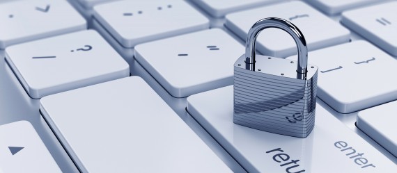 Picture of padlock on a white keyboard.